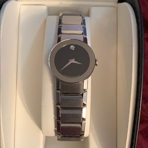 Ladies Movado sapphire watch with black face